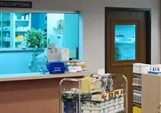 swinging door in a busy pharmacy